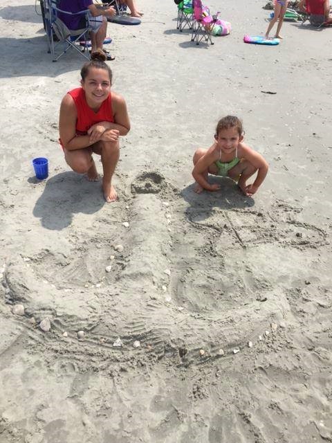 Students make a sand anchor while on summer vacation.