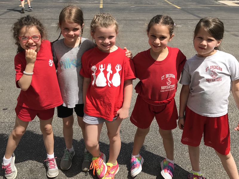 Students pose for a picture at recess