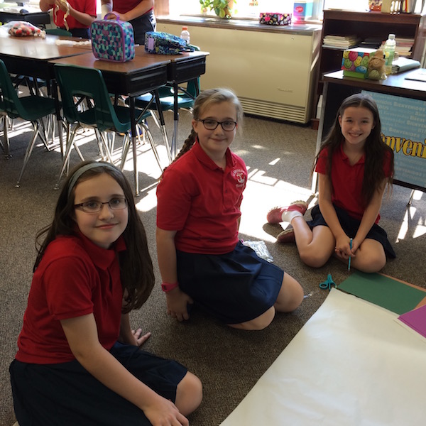 Students create a poster in a group project