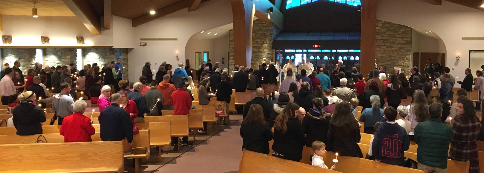 Fr. Tom blesses candles during Candlemas Day