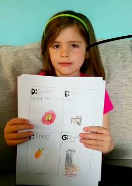 girl showing her A to Z project