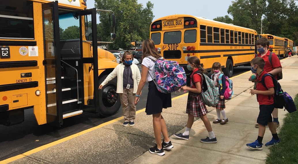 students loading on the school bus at the end of the day