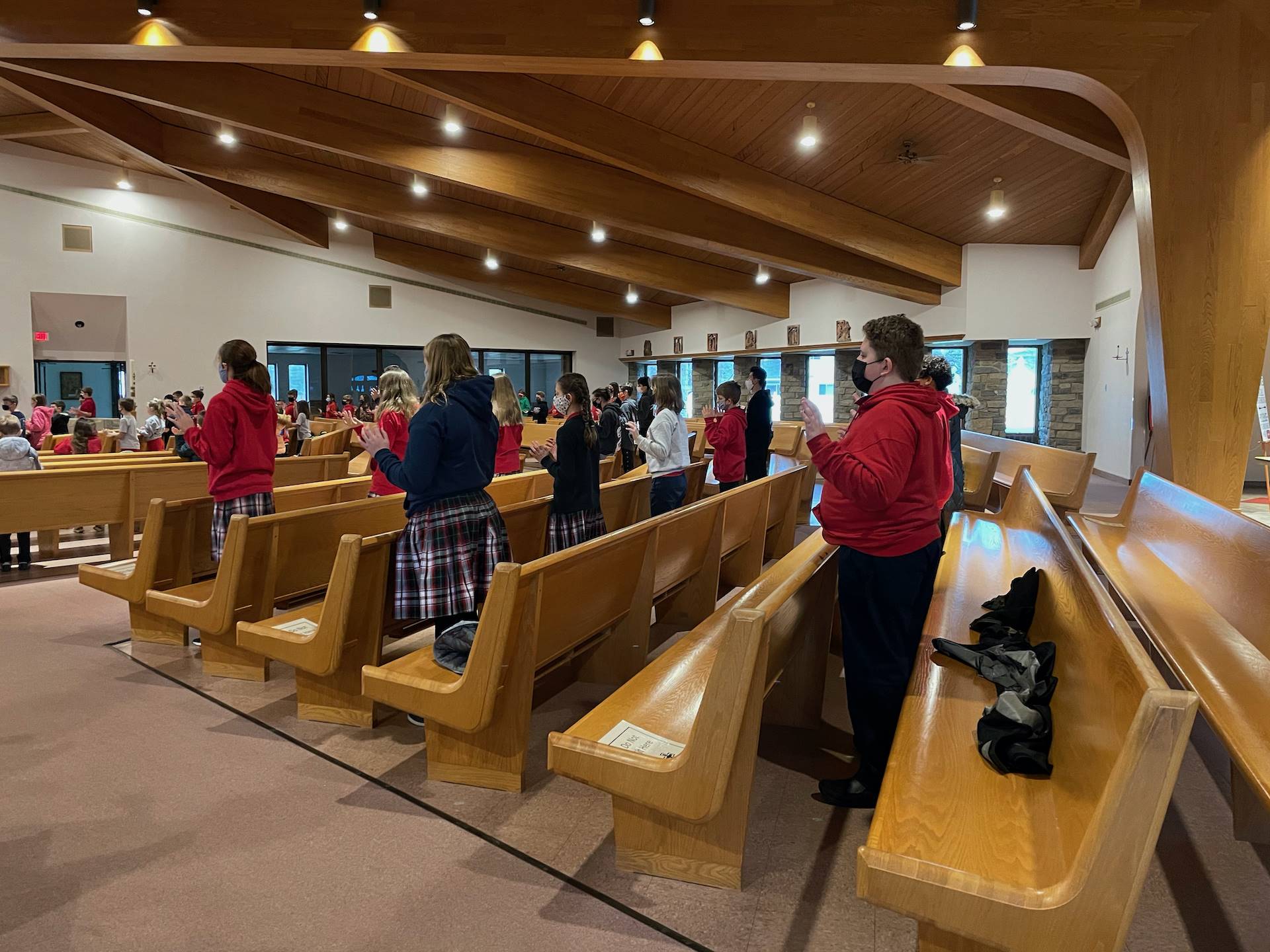 Students pray while at mass celebrating Catholic Schools