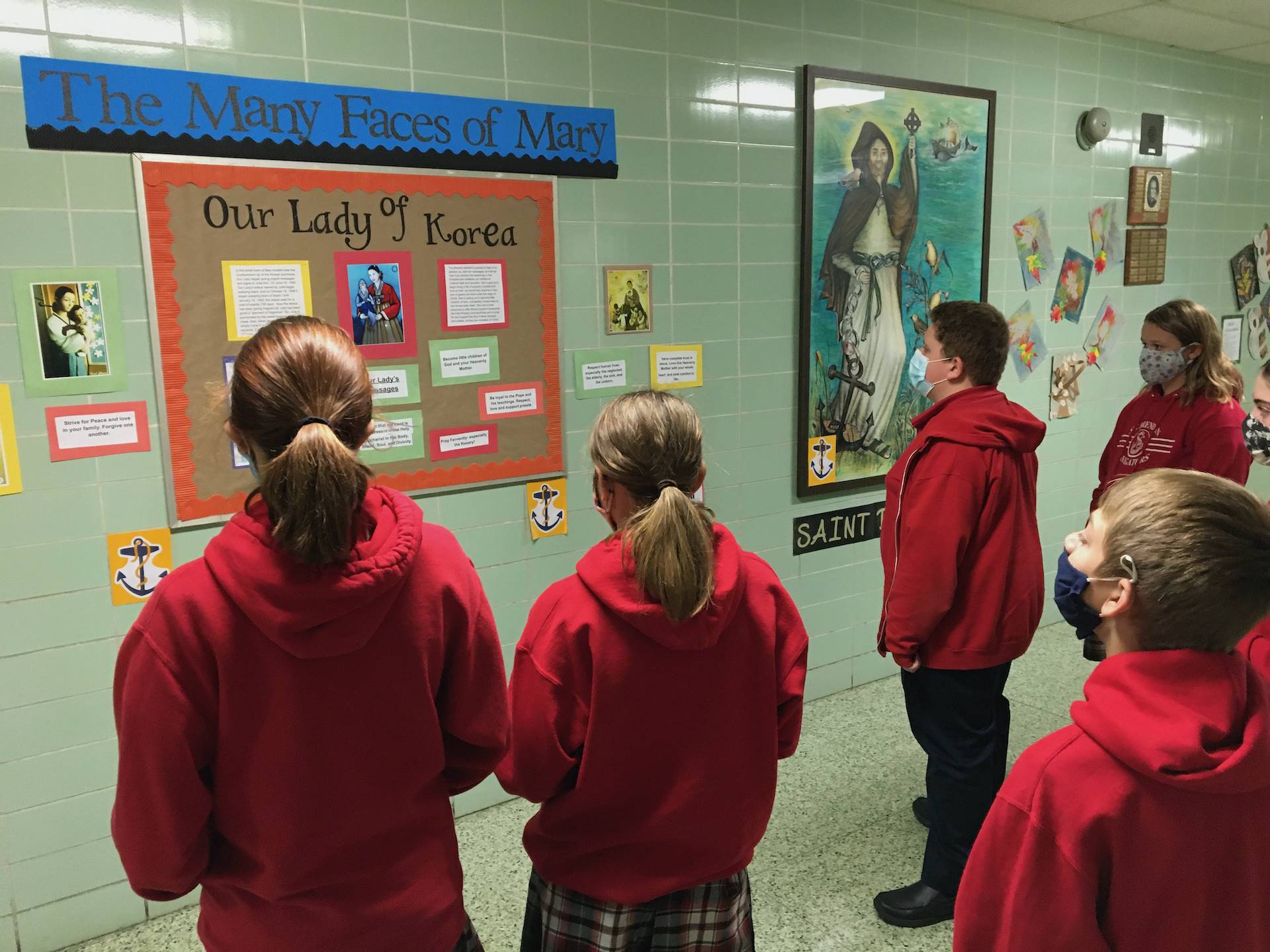 students use the Faces of mary bulletin board to learn about Mary of Korea