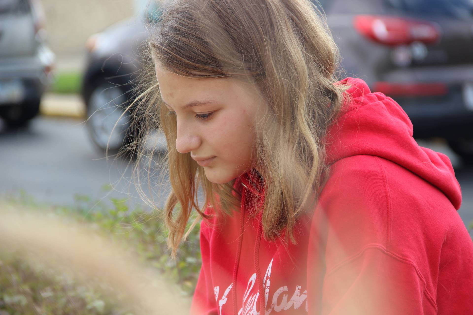 girl reflects in the our lady of knock prayer garden