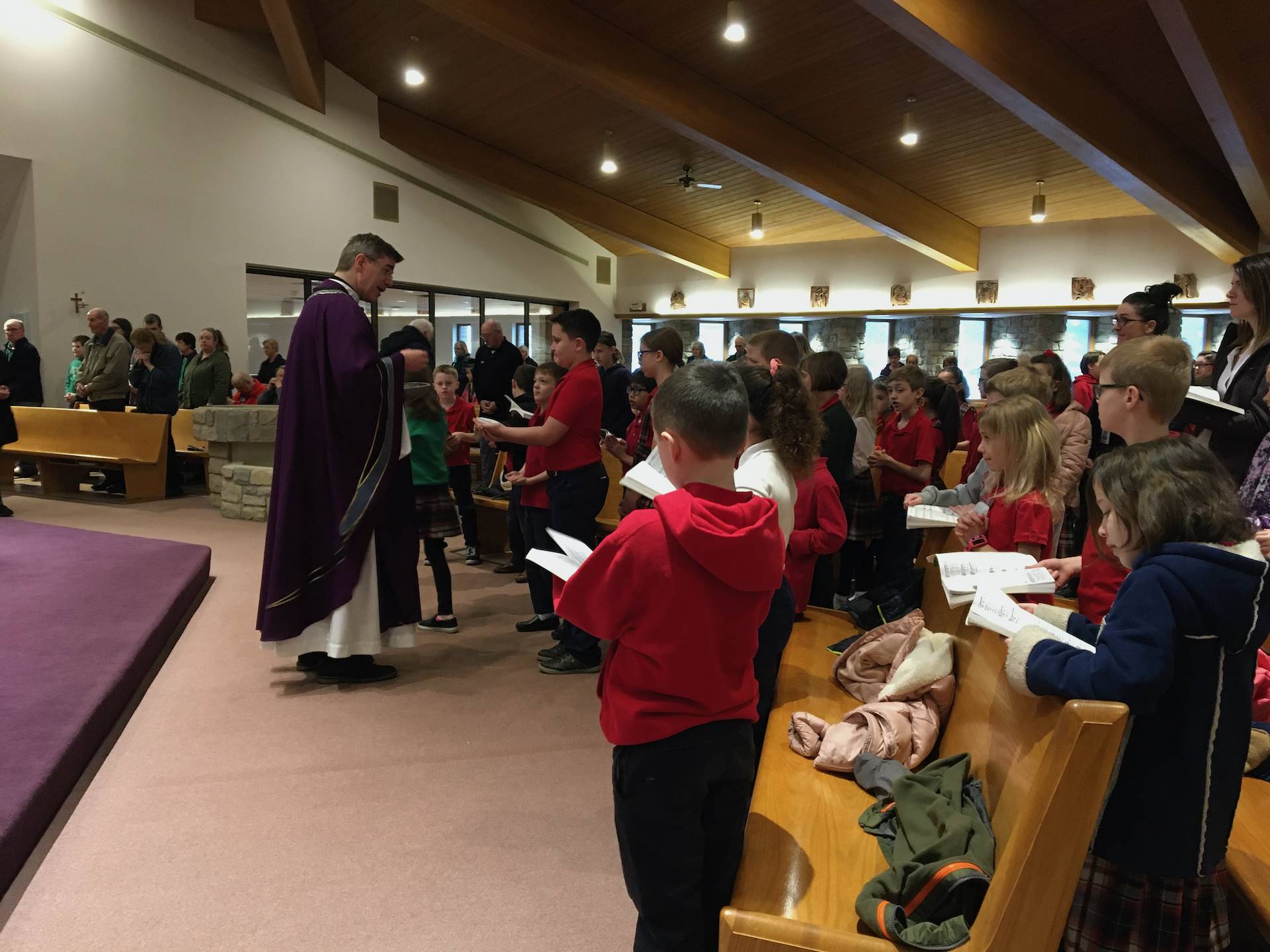 Fr tom distributes communion