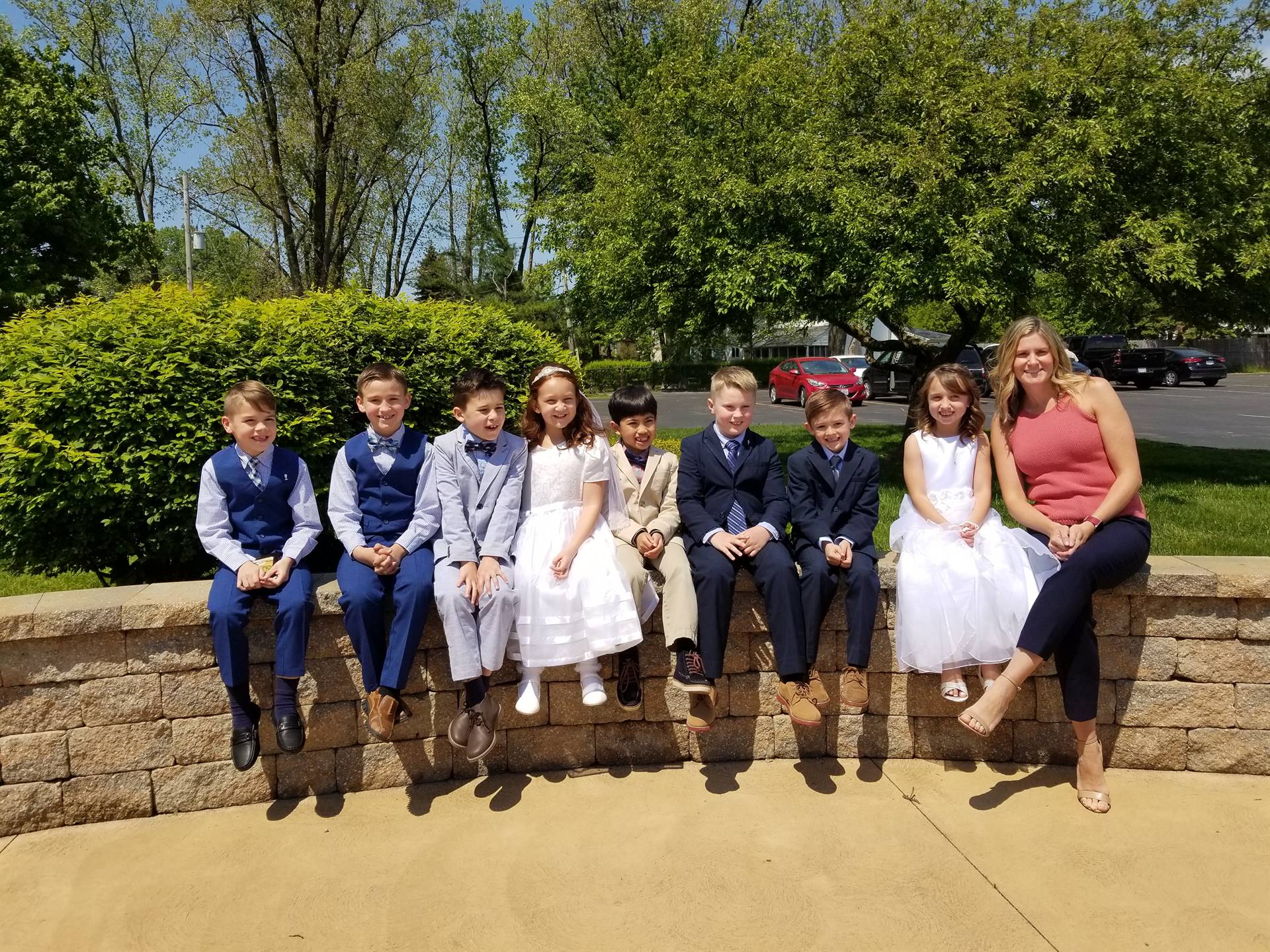 2nd grade teacher celebrate after first communion for the boys and girls