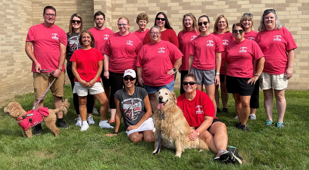 staff poses for a pictures at the annual walk a thon