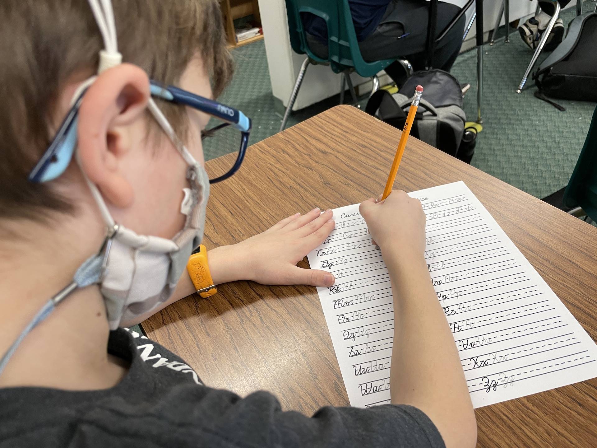 student practices handwriting