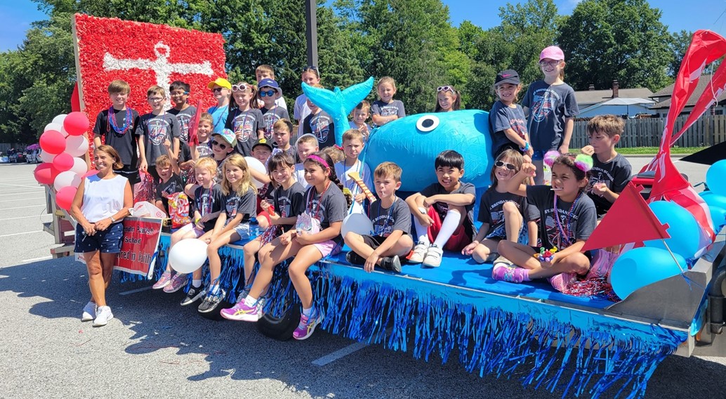 students on the north olmsted homedays parade float