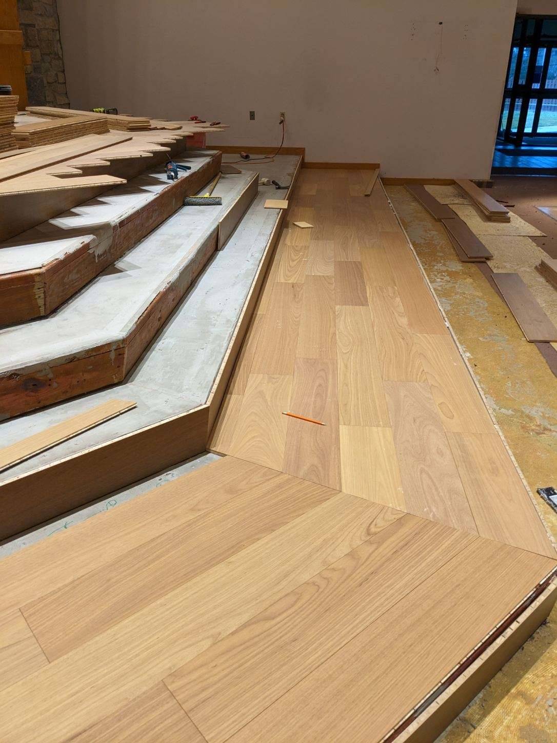 sanctuary steps, bottom step has new wood plank floor positioned