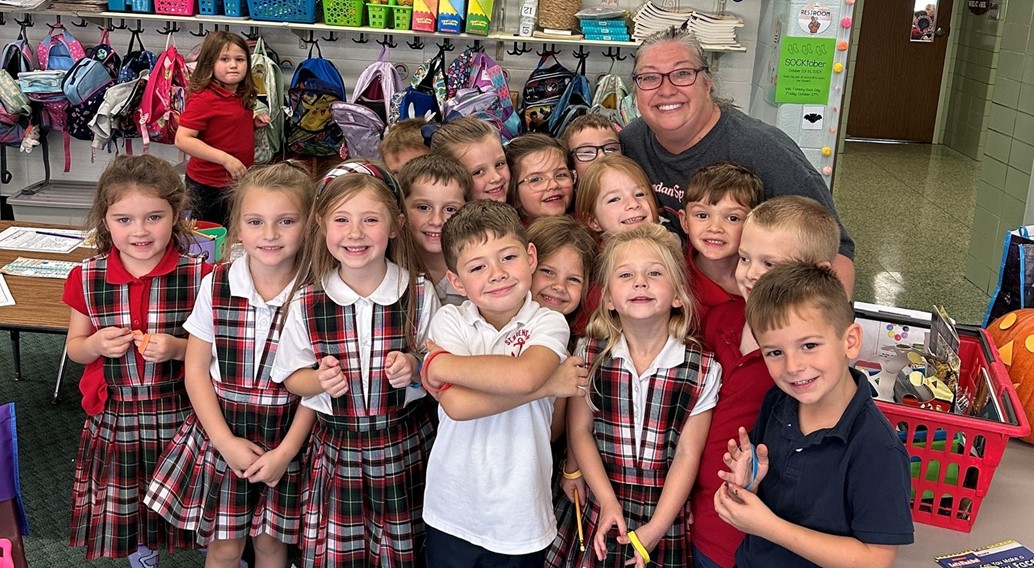 group hug goodbye for mrs. caroscio