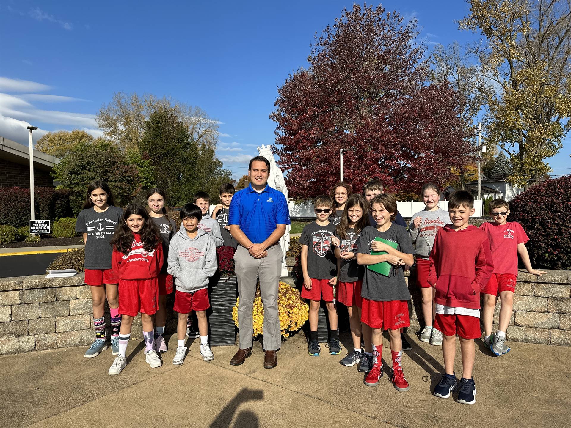 seminarian Cam joins 5th grade for a rosary on a sunny day