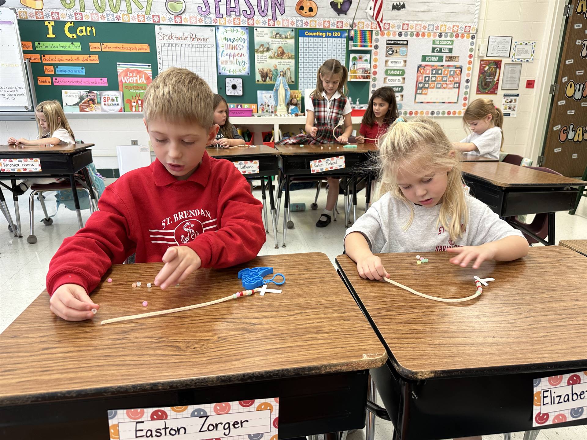 students making rosaries