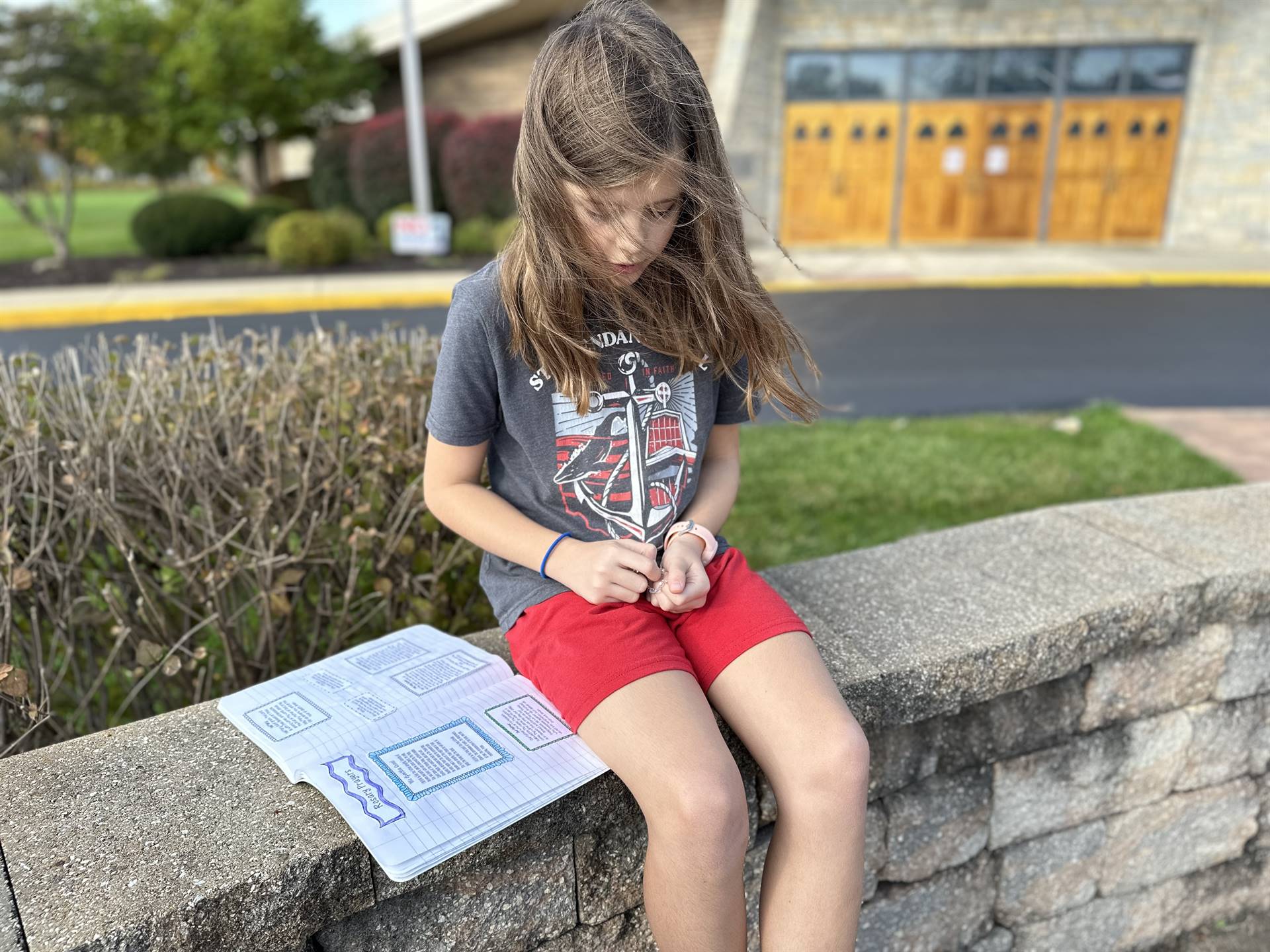 grade 5 prays the rosary in the prayer garden