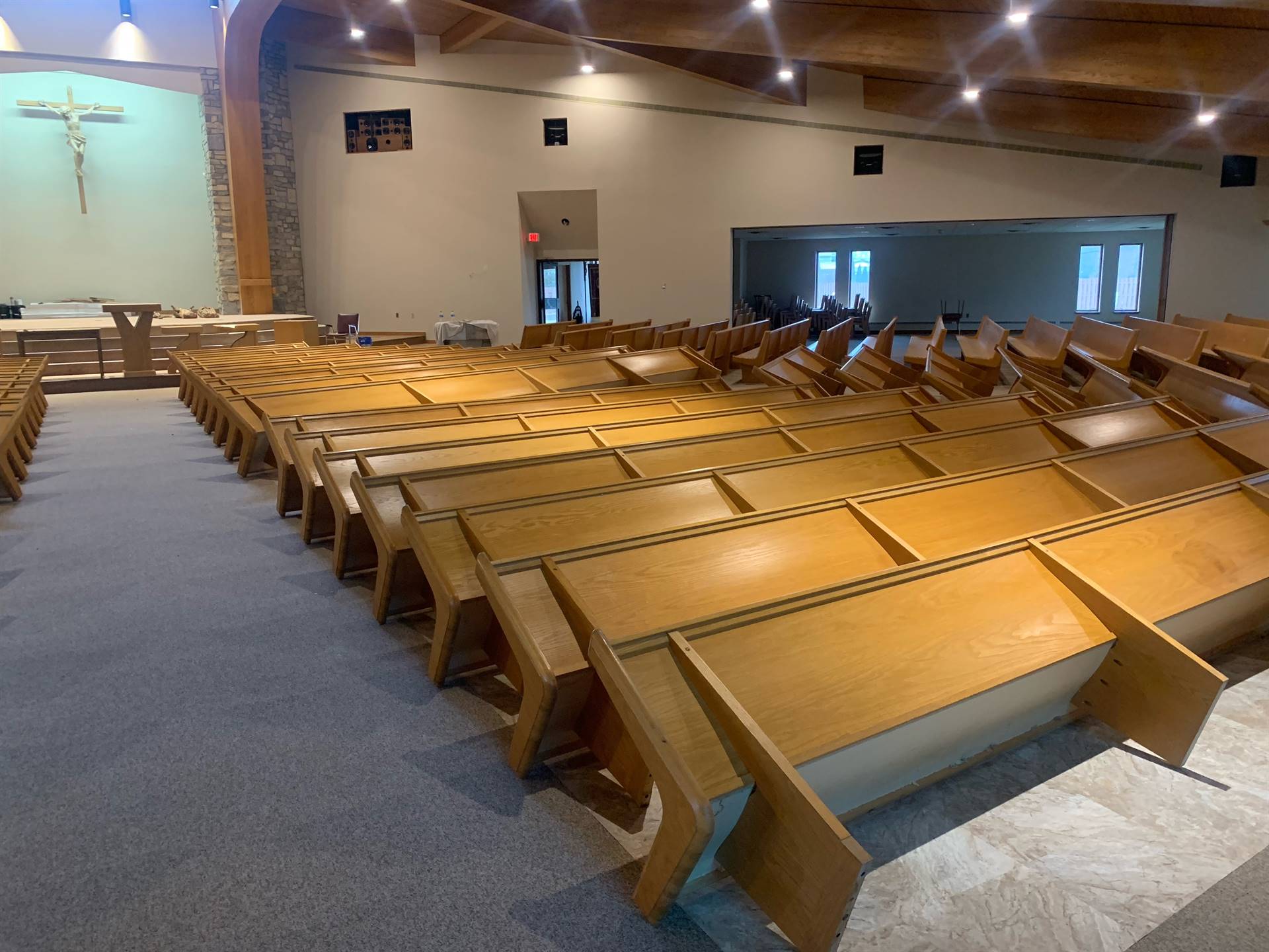 pews being stained and reinstalled
