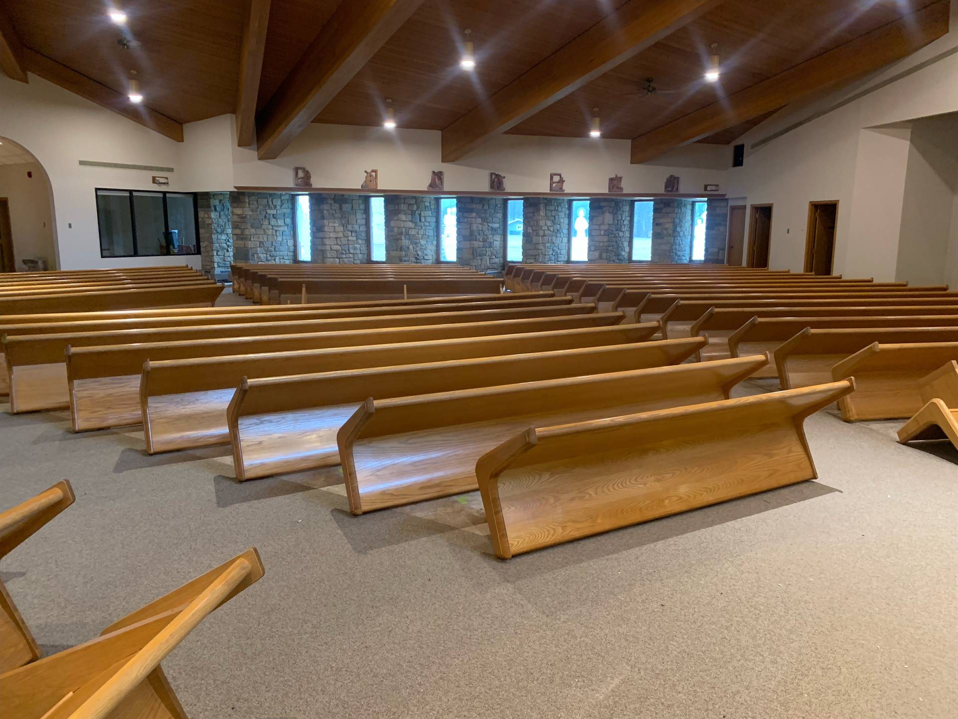 pews being stained and reinstalled