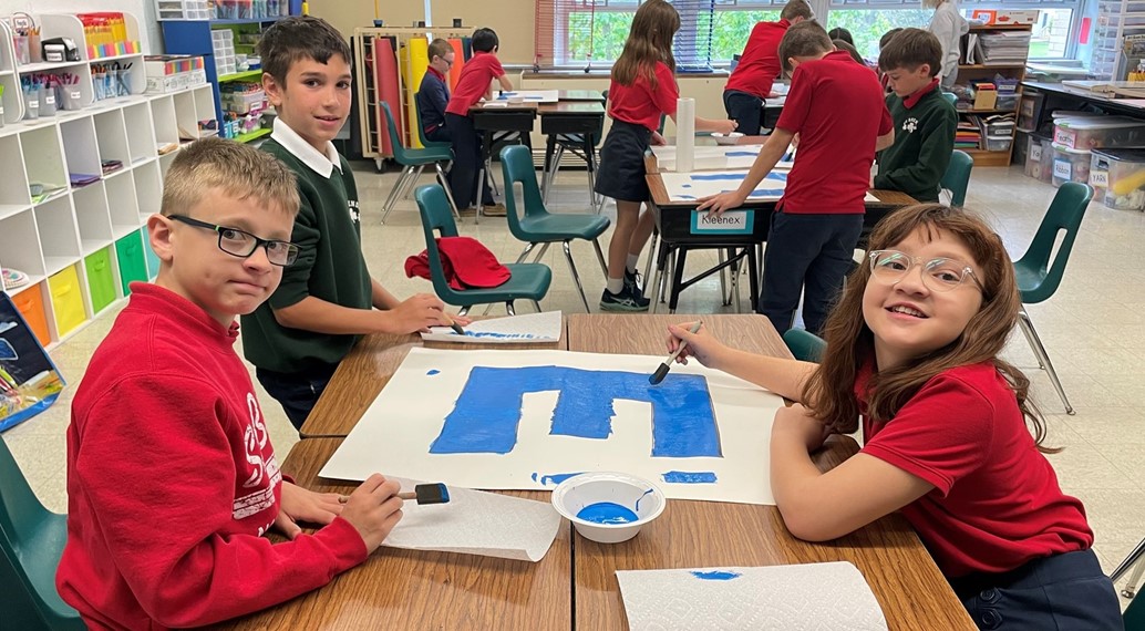 grade 4 works on their gallery walk piece