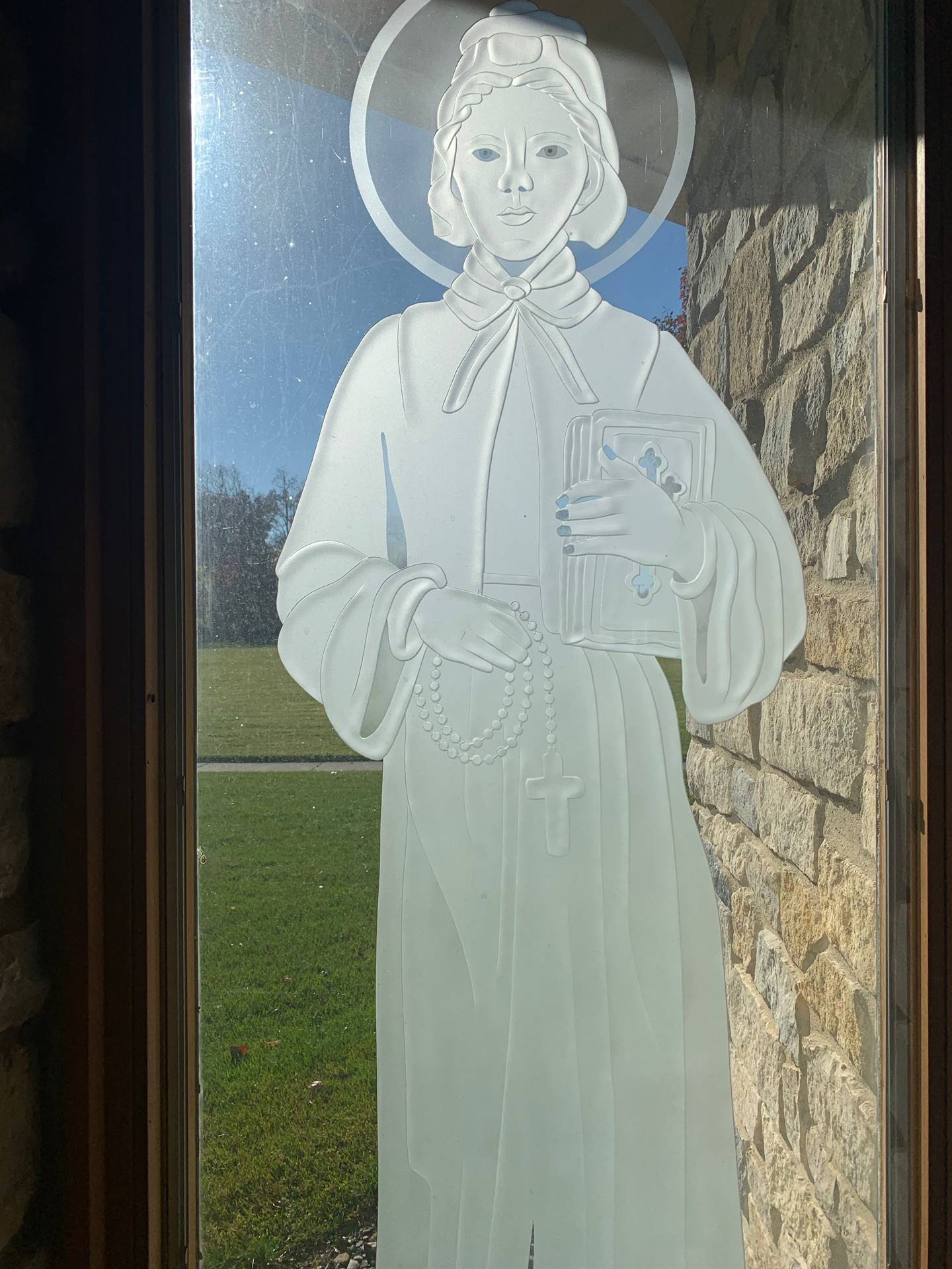 etched windows of saints