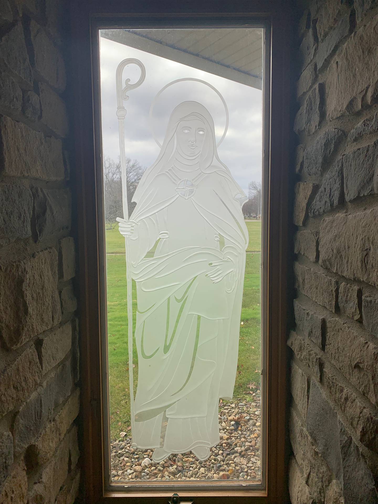 etched windows of saints