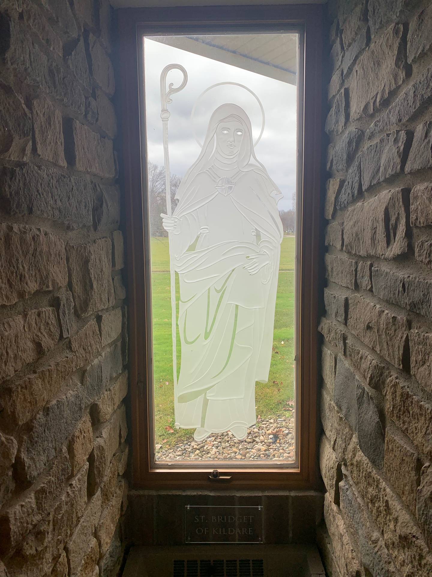 etched windows of saints