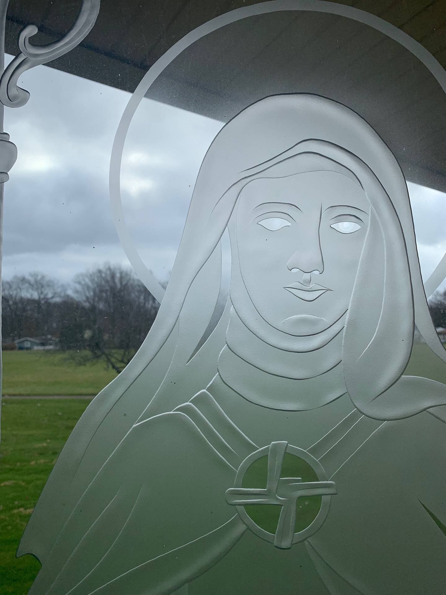 etched windows of saints