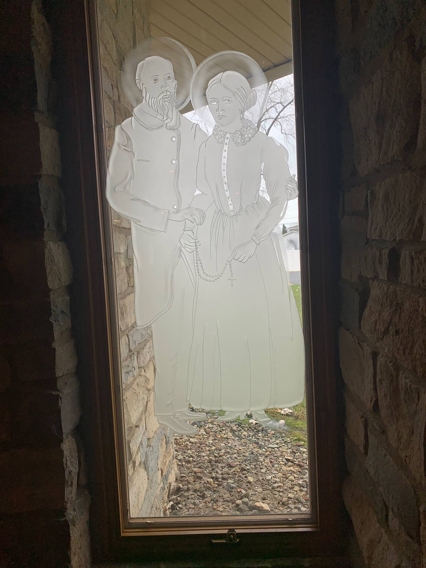 etched windows of saints