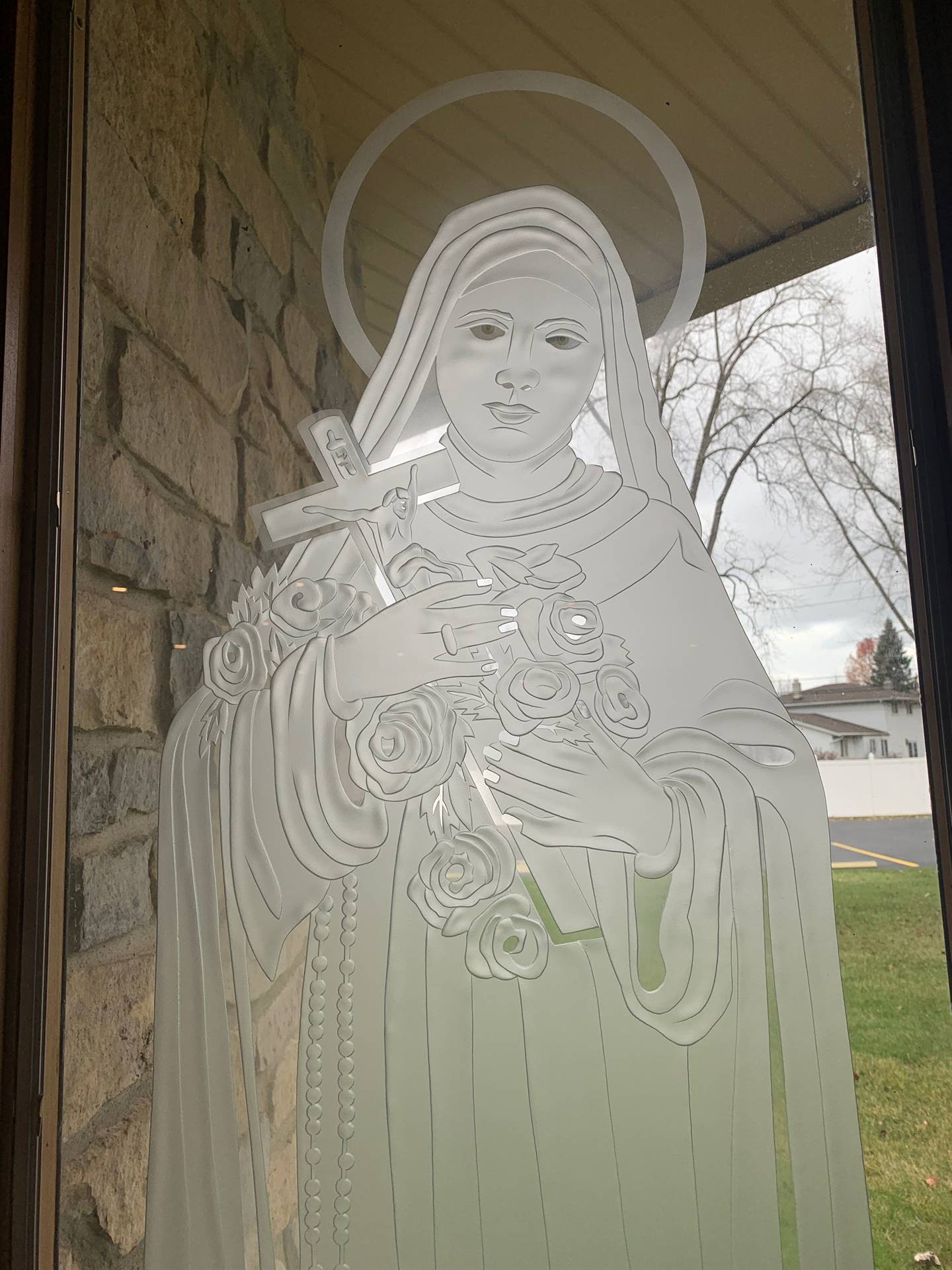 etched windows of saints
