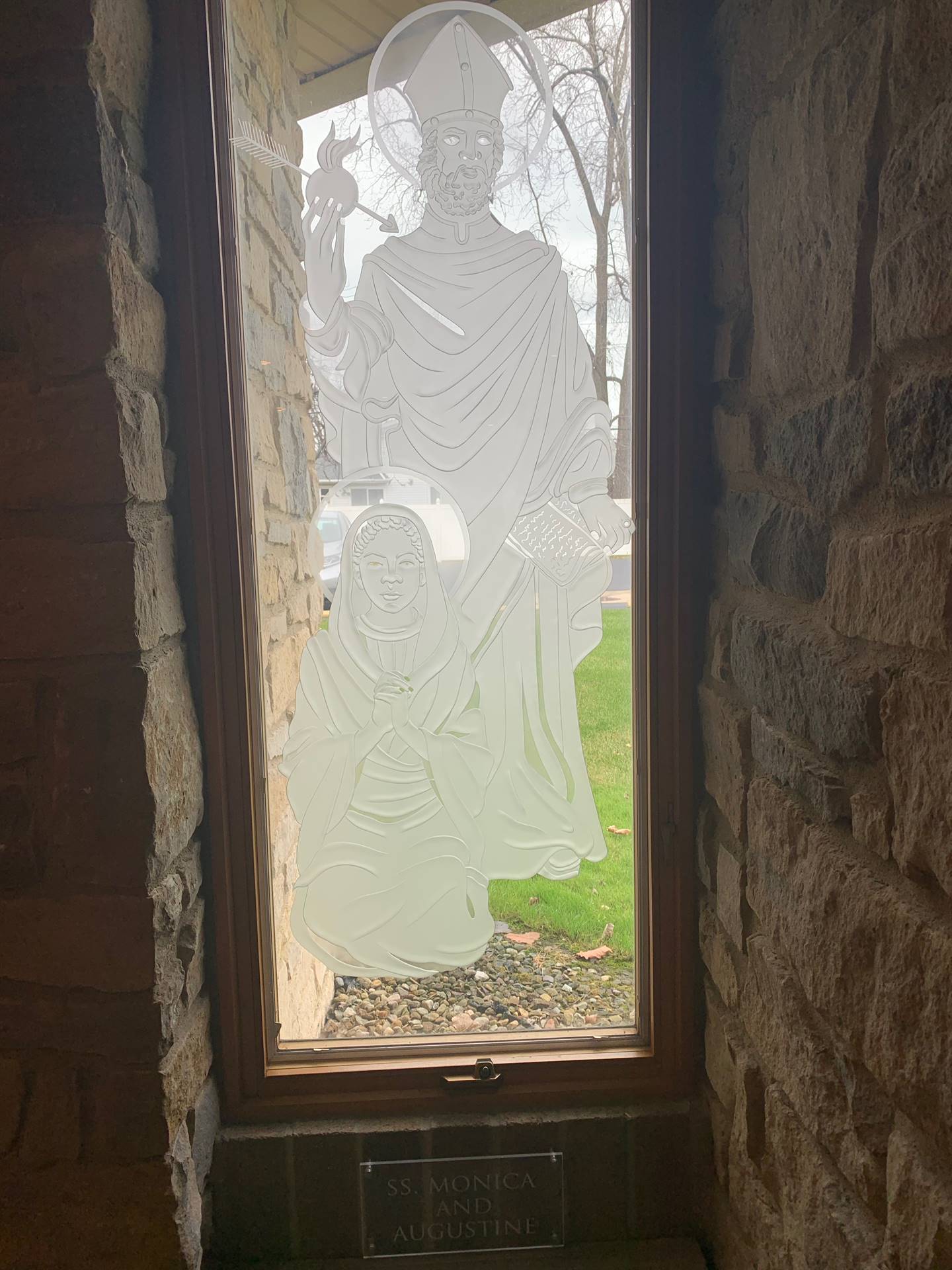 etched windows of saints