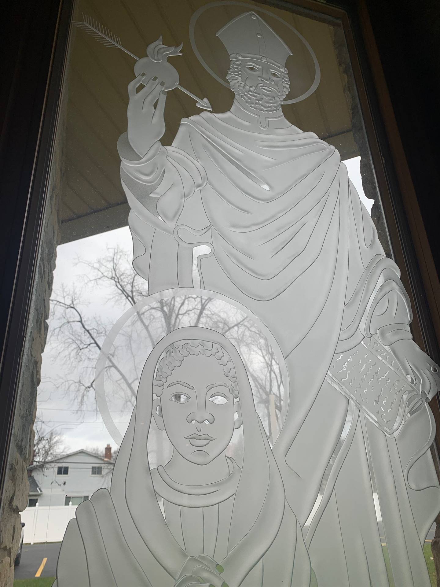 etched windows of saints