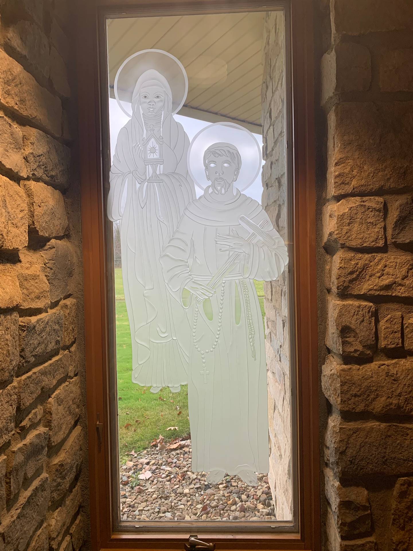 etched windows of saints