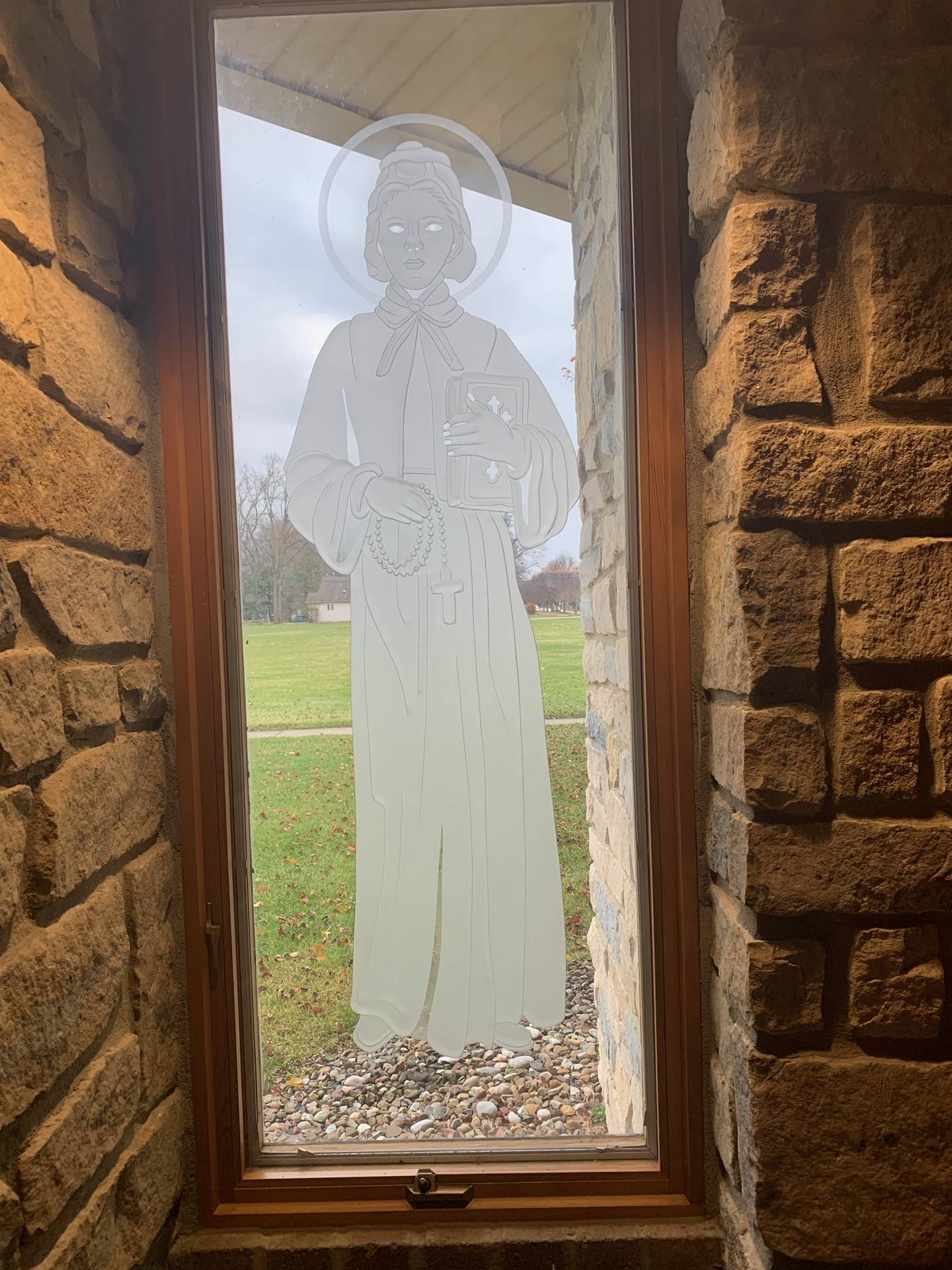 etched windows of saints