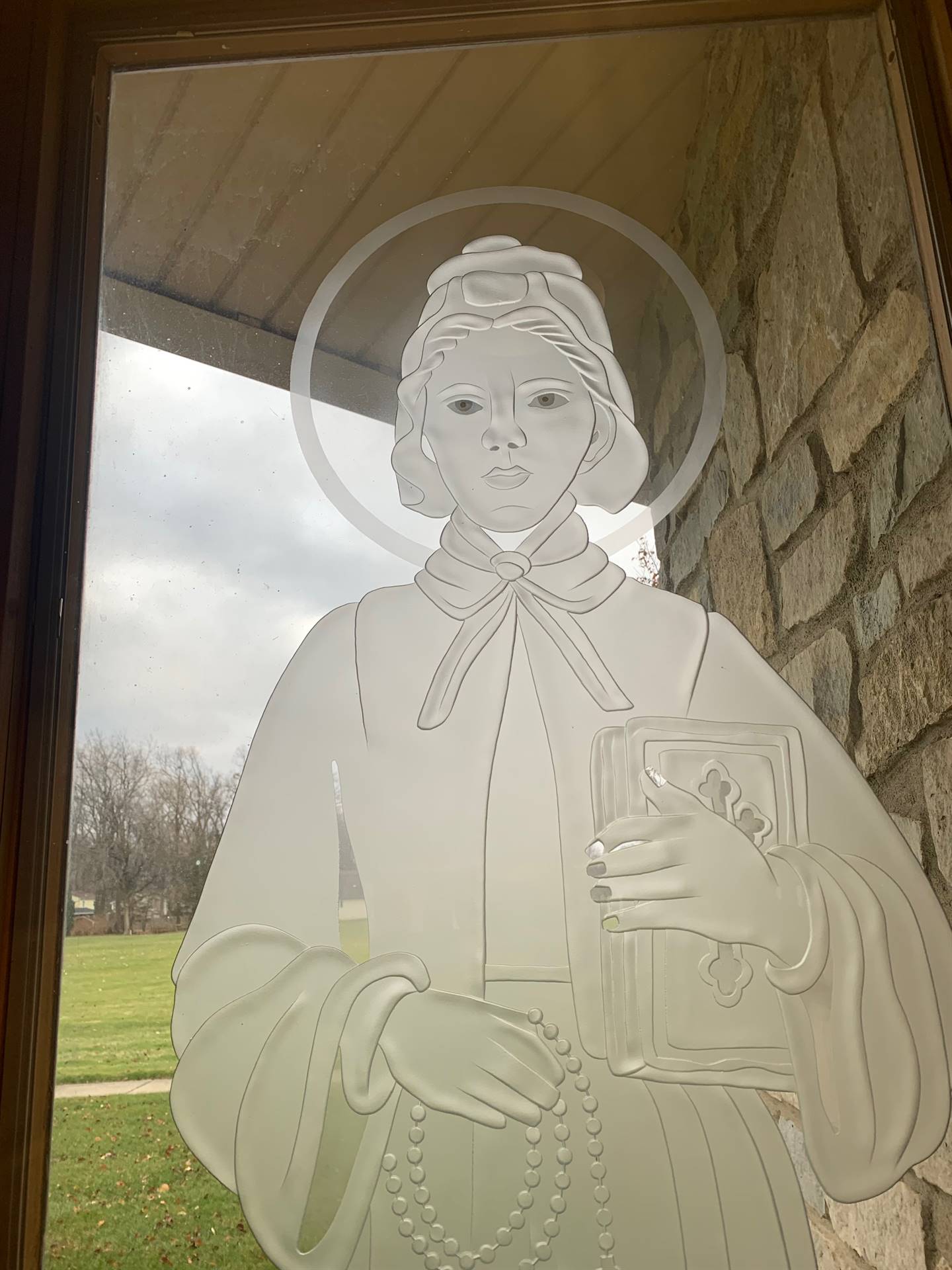 etched windows of saints