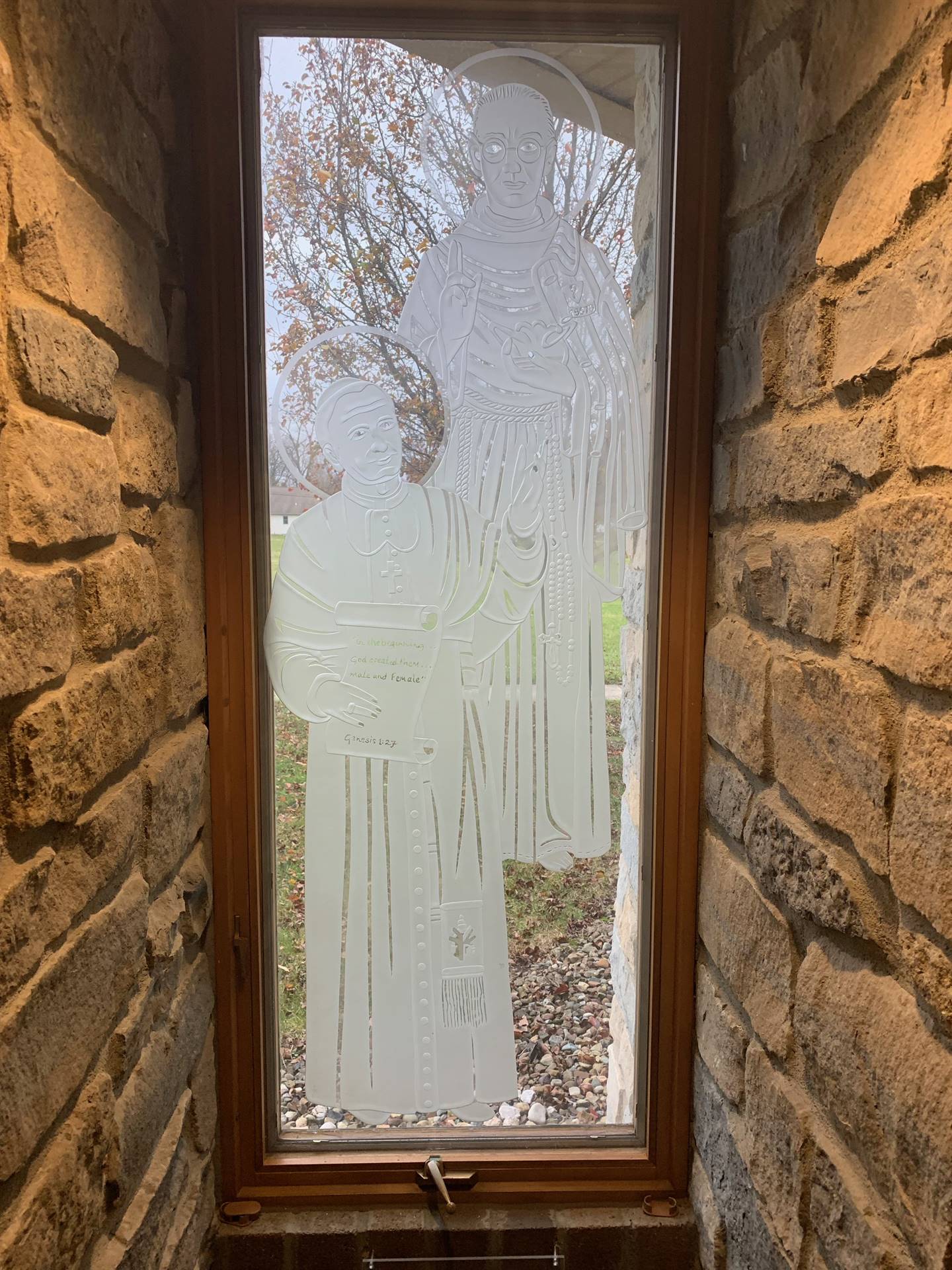 etched windows of saints