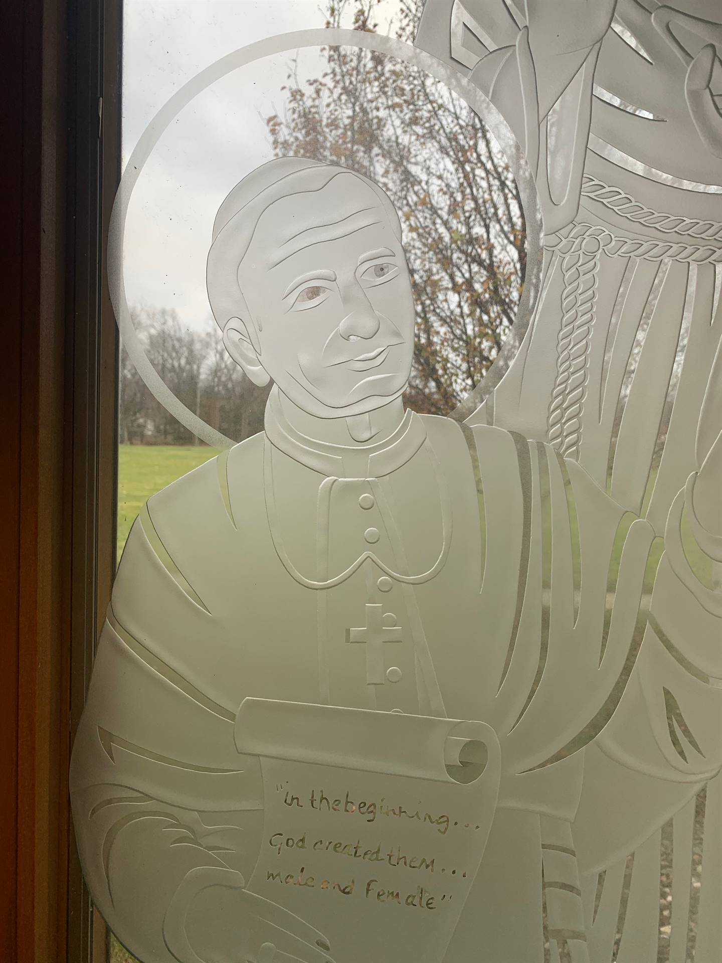 etched windows of saints