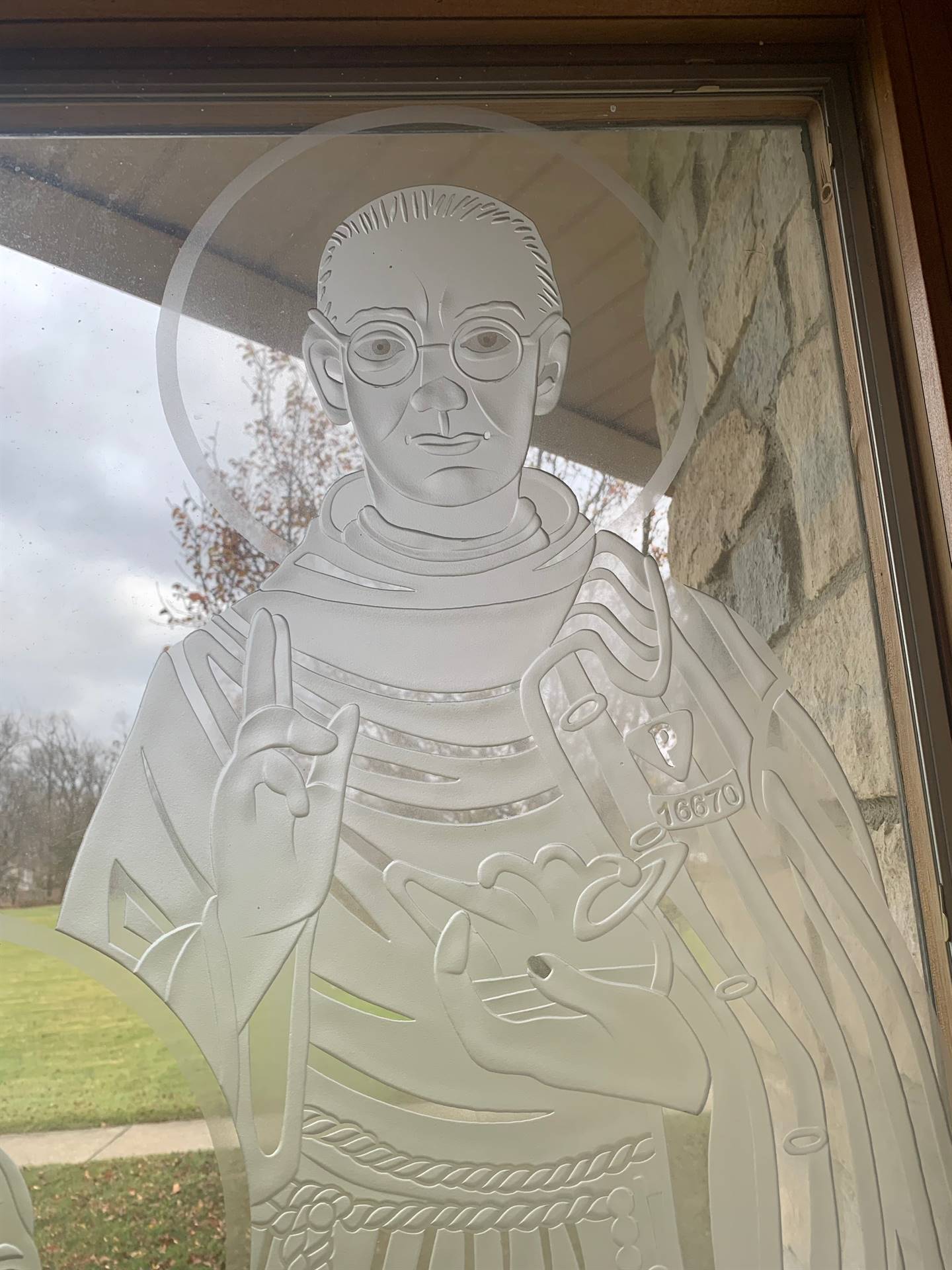 etched windows of saints