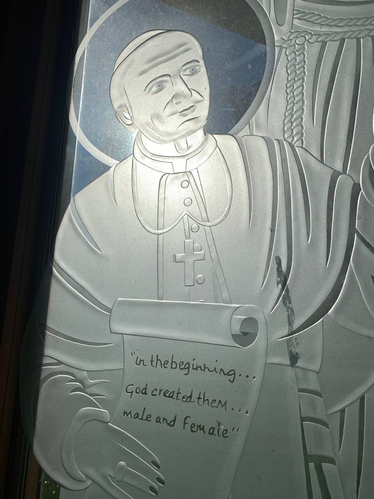 etched windows of saints