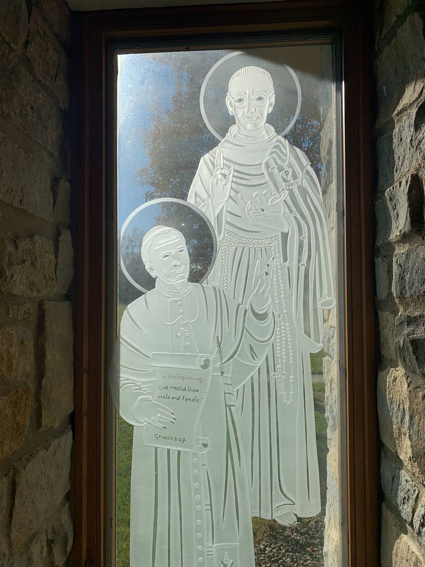 etched windows of saints