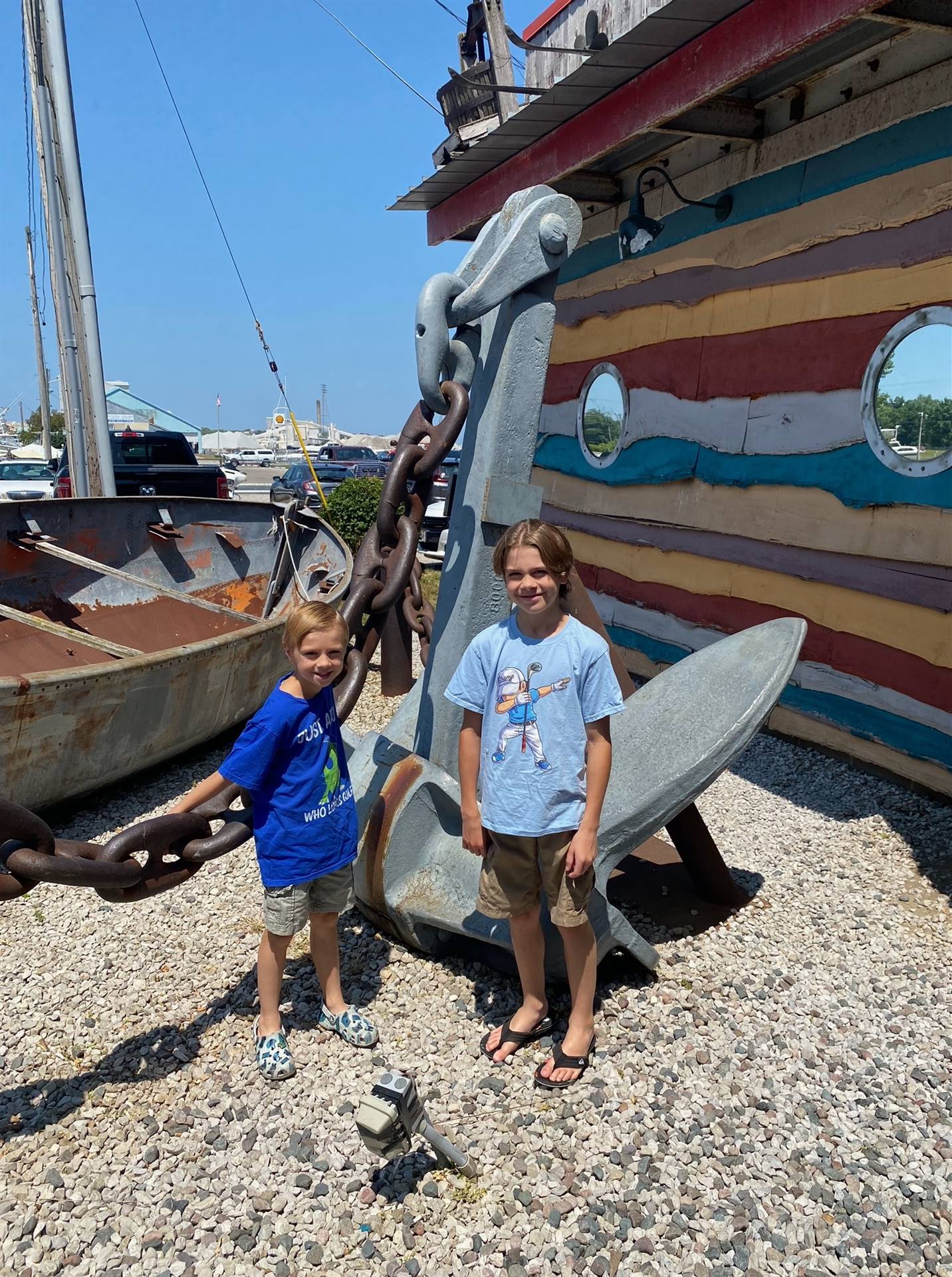 students pose by and anchor on summer break