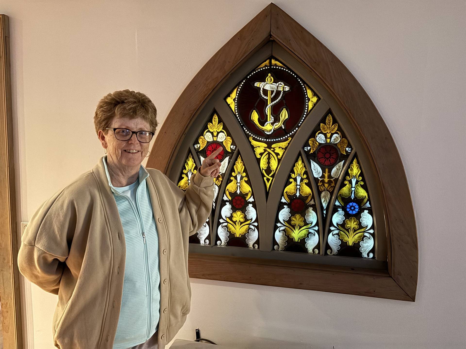 teacher finds and anchor while on vacation in a church stained glass window