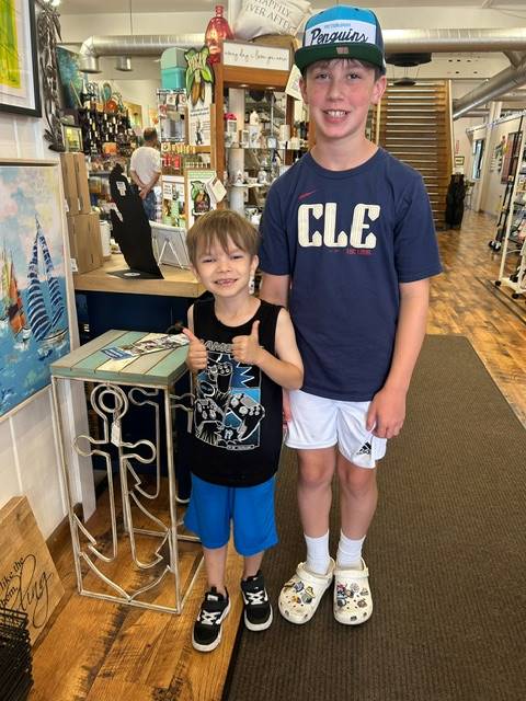 students find an anchor table in a souvenir shop on summer break