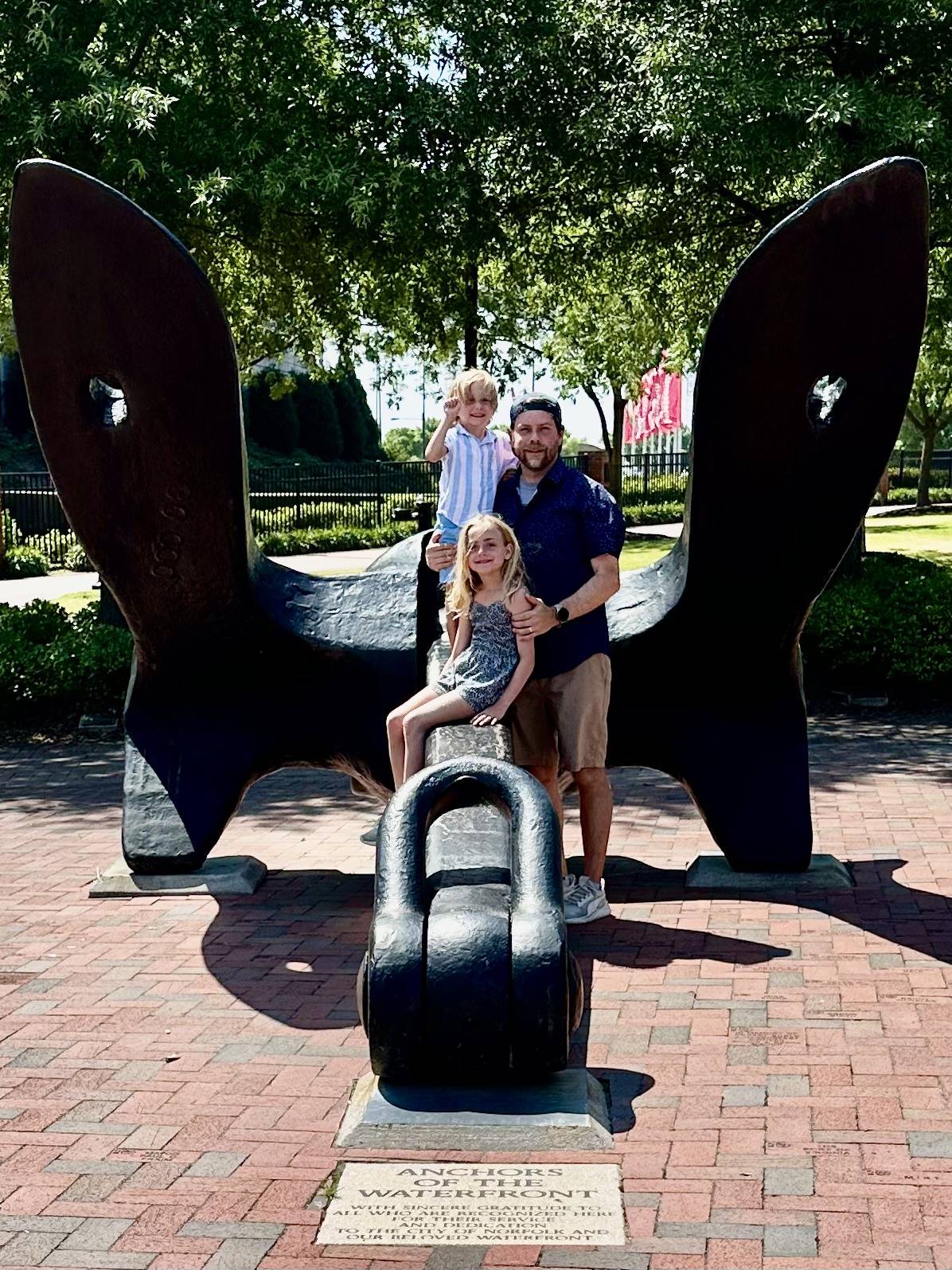 teacher and his children, students in the school find and anchor while on vacation
