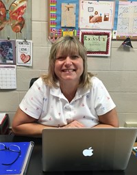 Mrs. D at her desk