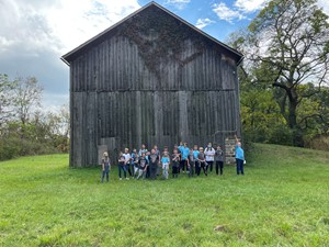 students in front of barn