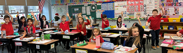 students raising hands